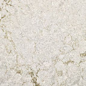 A close up of a white granite counter top with a marble texture.