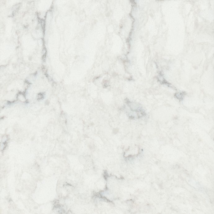 A close up of a white marble counter top.