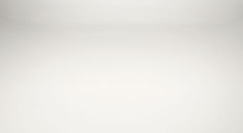 A close up of a white background with a gray gradient.