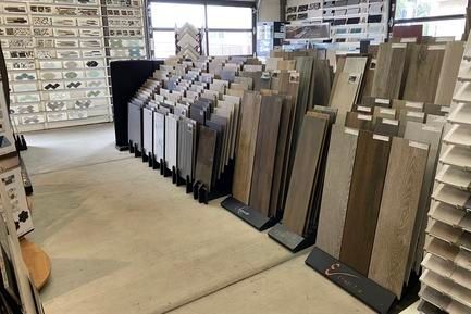 There are many different types of tiles on display in this store.