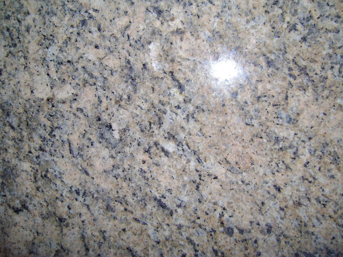 A close up of a granite counter top showing the texture