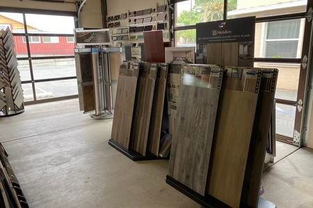 A room filled with lots of tiles on display in a store.