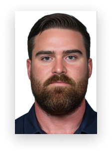 A man with a beard is wearing a blue shirt