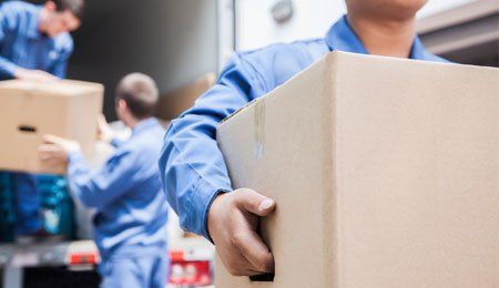 Movers unloading boxes - Moving service in Leesburg, VA