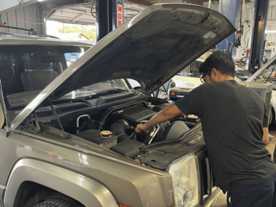 Technician Doing Maintenance on Vehicle