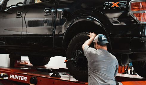 Technician Working on Tire