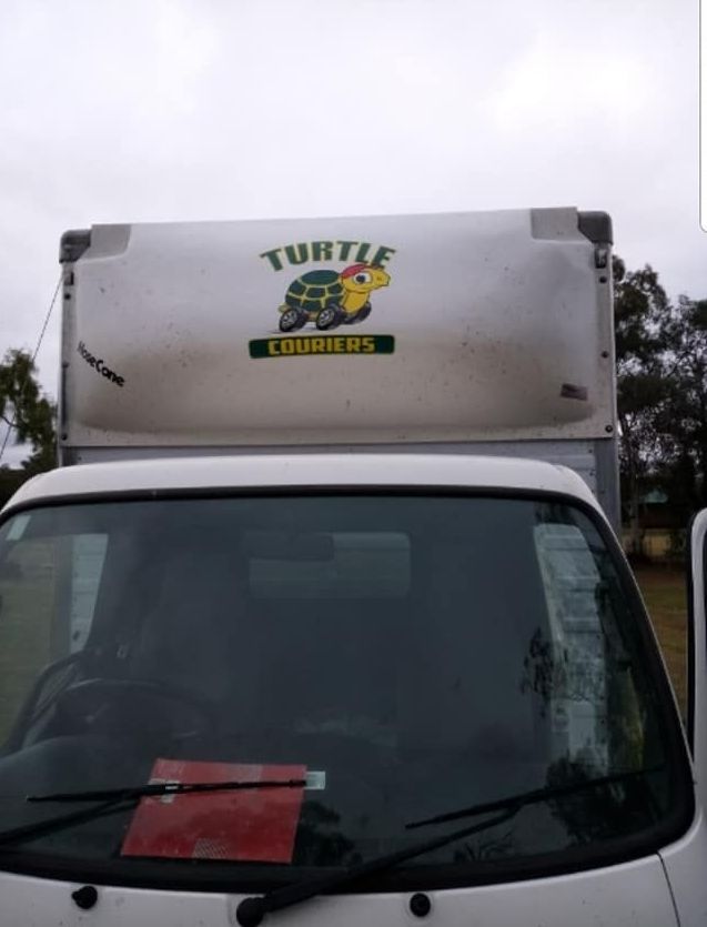 White Truck With a Turtle on the Side of It - Turtle Couriers in Tamworth, NSW