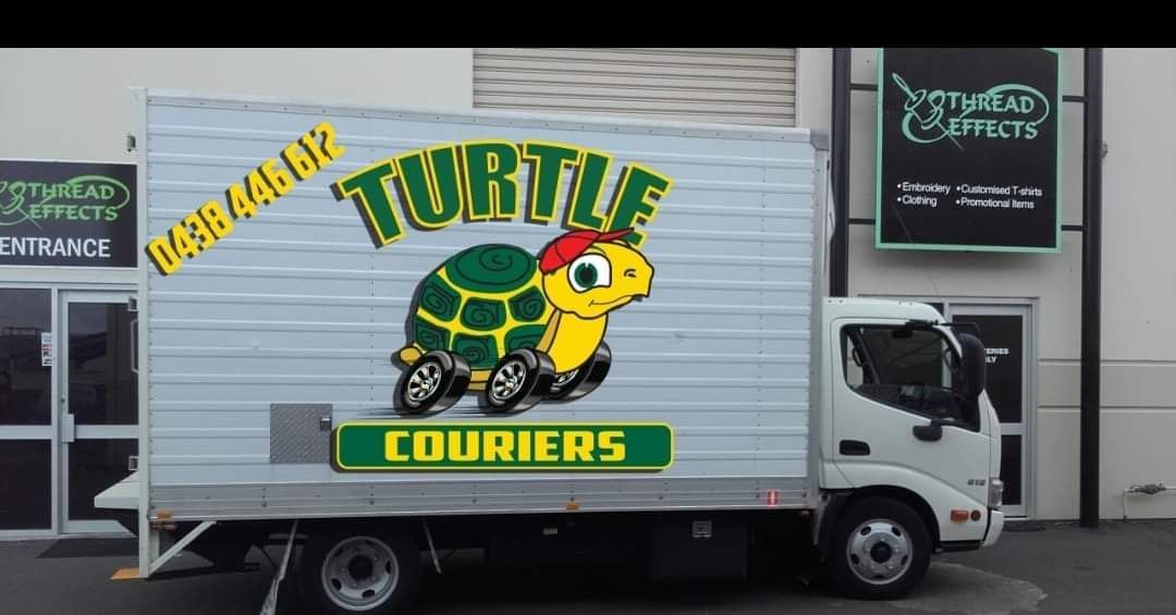 Turtle Courier Truck is Parked in Front of a Building - Turtle Couriers in Tamworth, NSW
