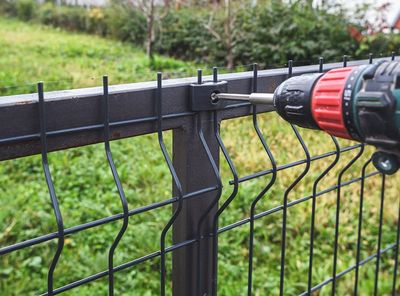 Screwing Grating Wire Industrial Fence Panels — Madison, TN — Music City Fence Company