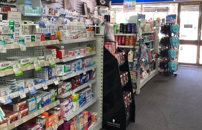 The inside of a pharmacy filled with lots of products.
