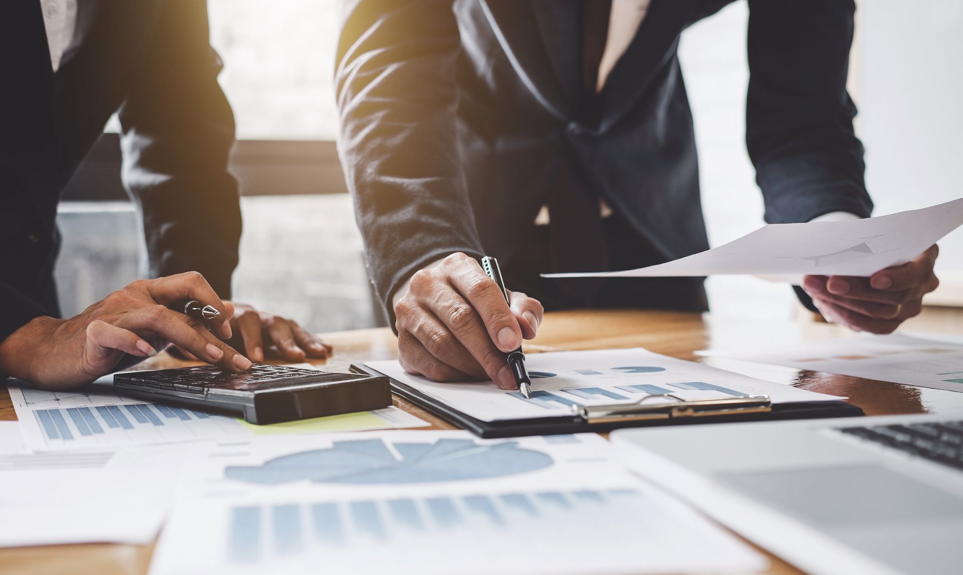 Businesspeople reviewing financial data