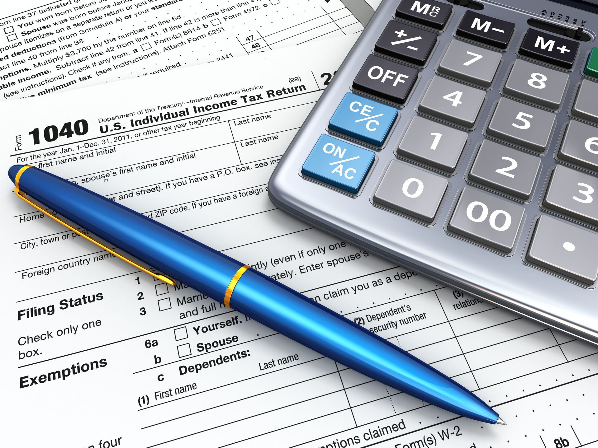 Tax form, calculator, and blue pen, likely for tax preparation