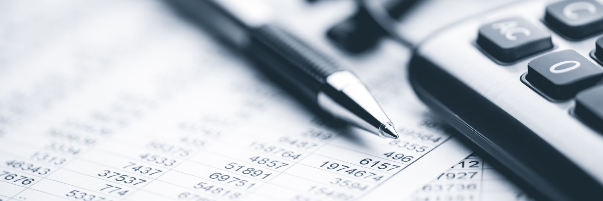 Pen, calculator, and financial report