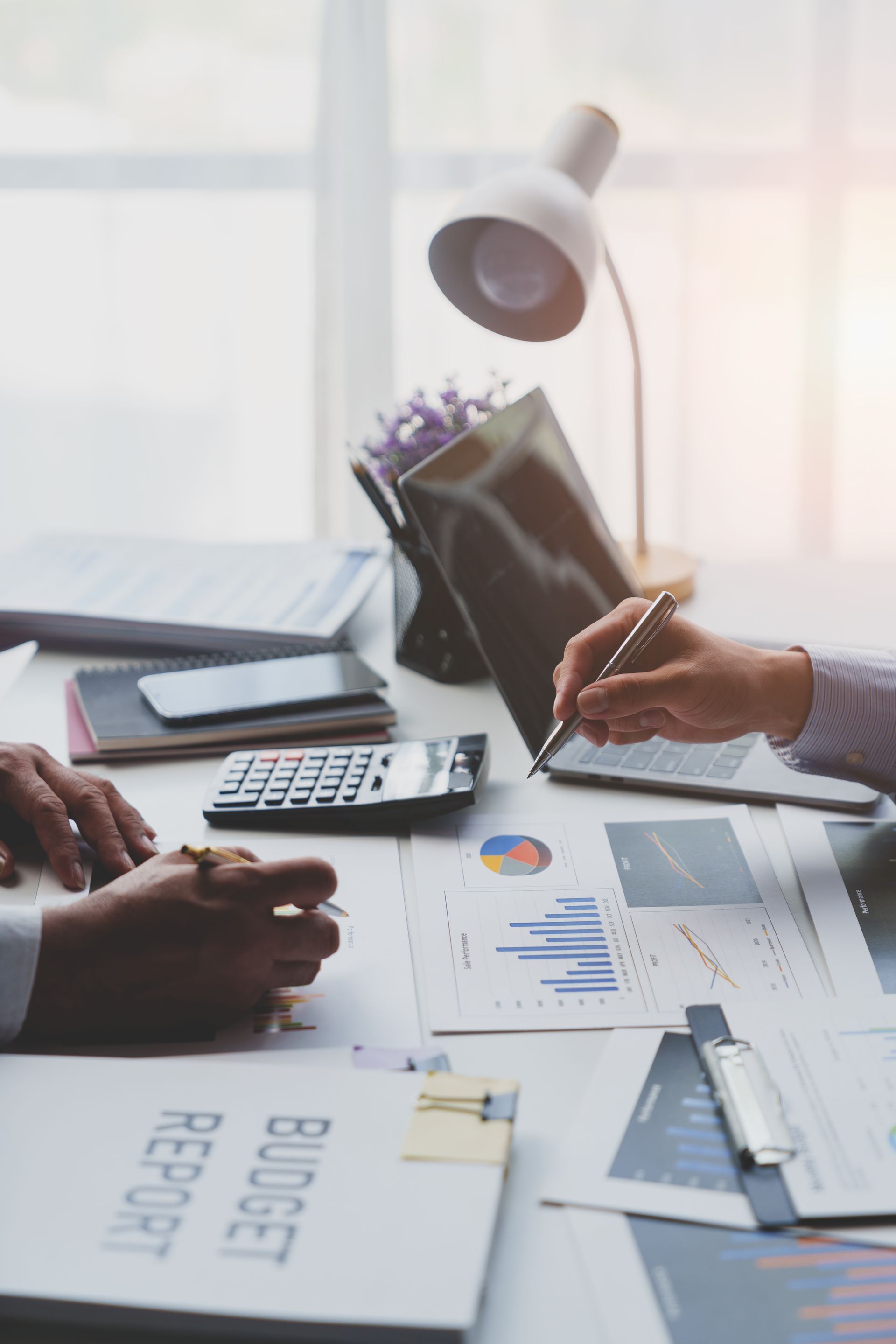 Two people reviewing financial documents