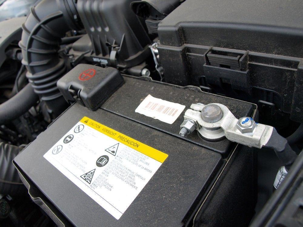 A Car Battery with Attached Cable — BEB Automotive In Sutherland, NSW
