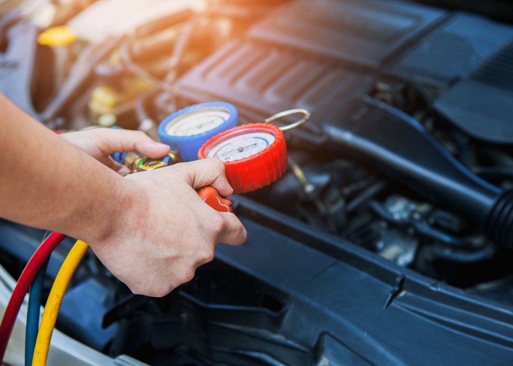 A Mechanic Checking Car Air Conditioning with Gauges — BEB Automotive In Sutherland, NSW