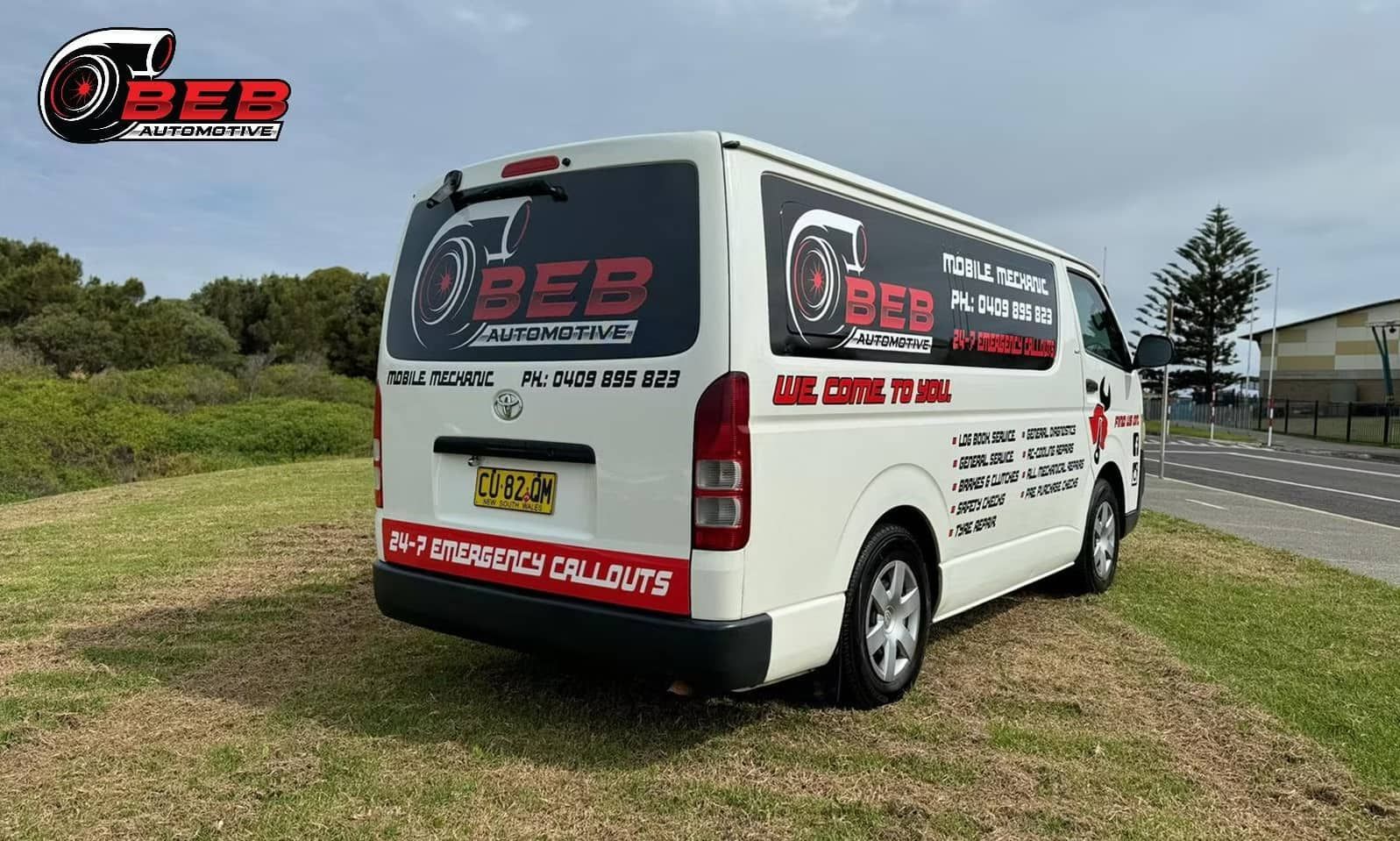 A White Van Is Parked on The Side of The Road — BEB Automotive In Berkeley, NSW