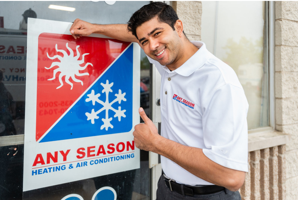 Any Season Heating & Air Conditioning — Guy Leaning On A Glass Wall in Tinley Park, IL