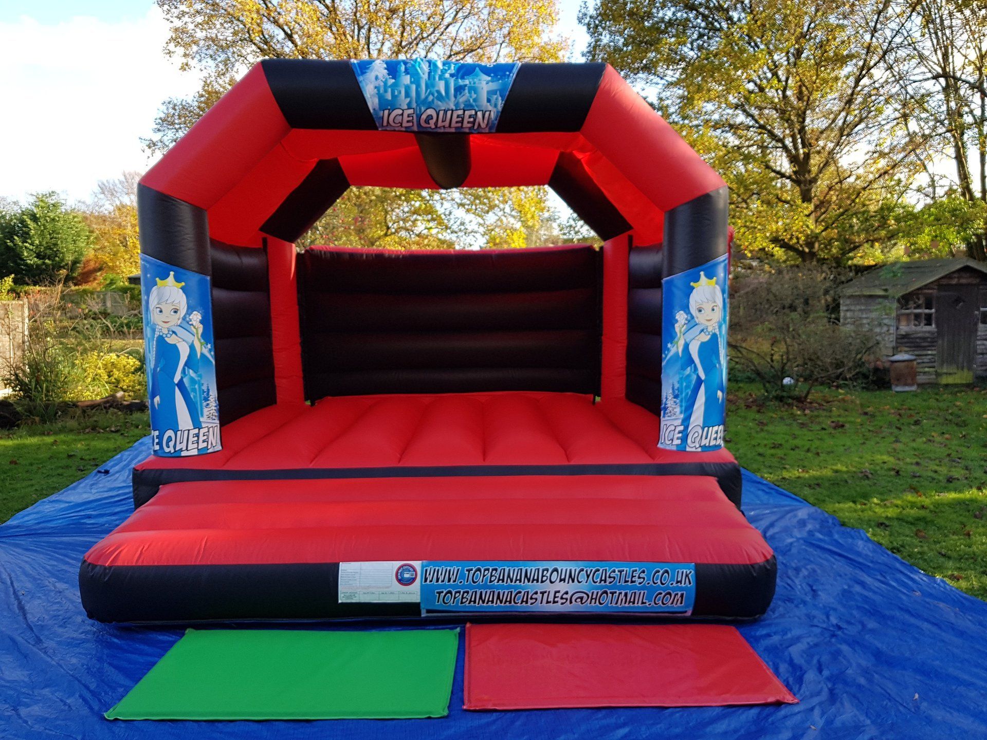 adult red and black bouncy castle with snow queen theme