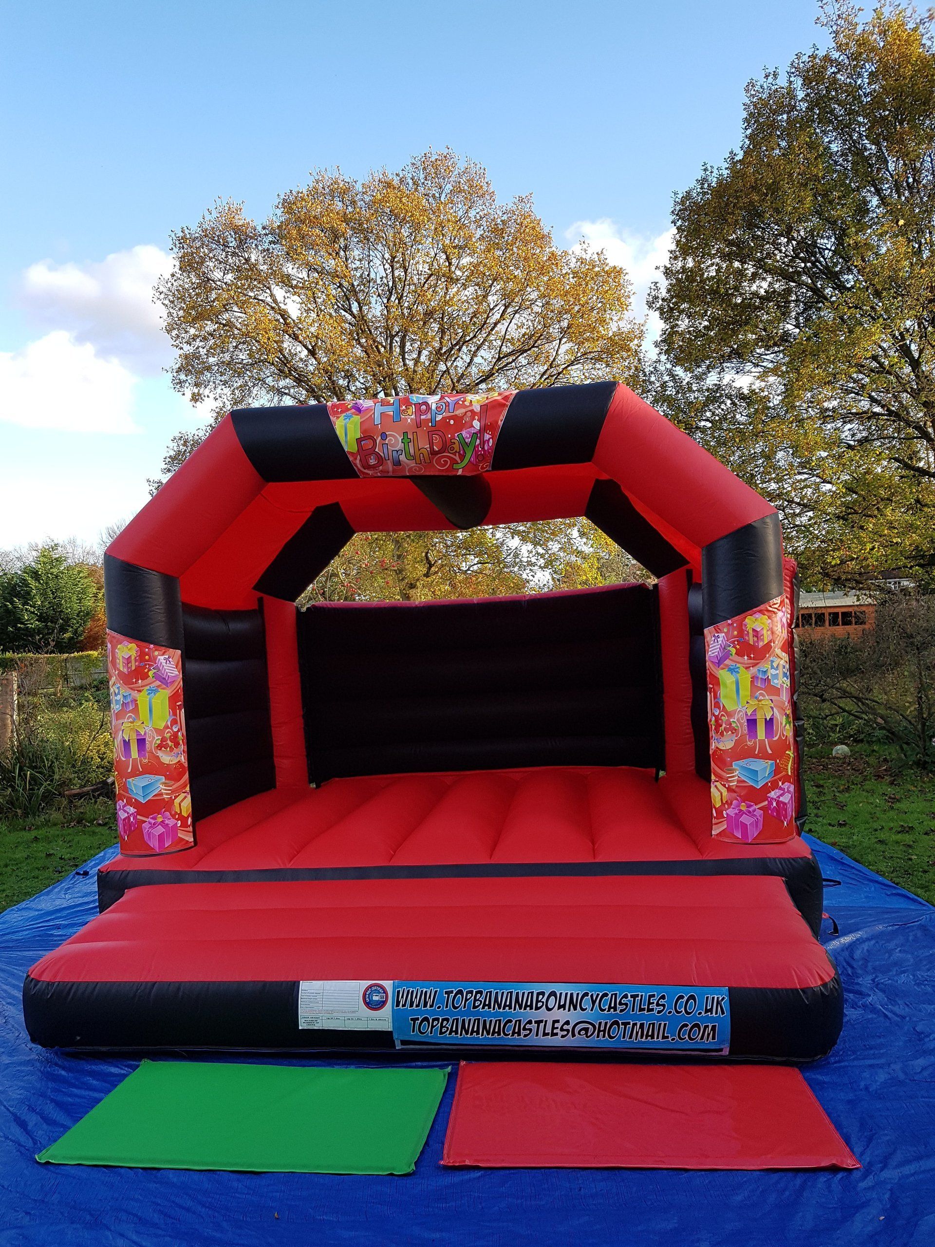 adult red and black bouncy castle