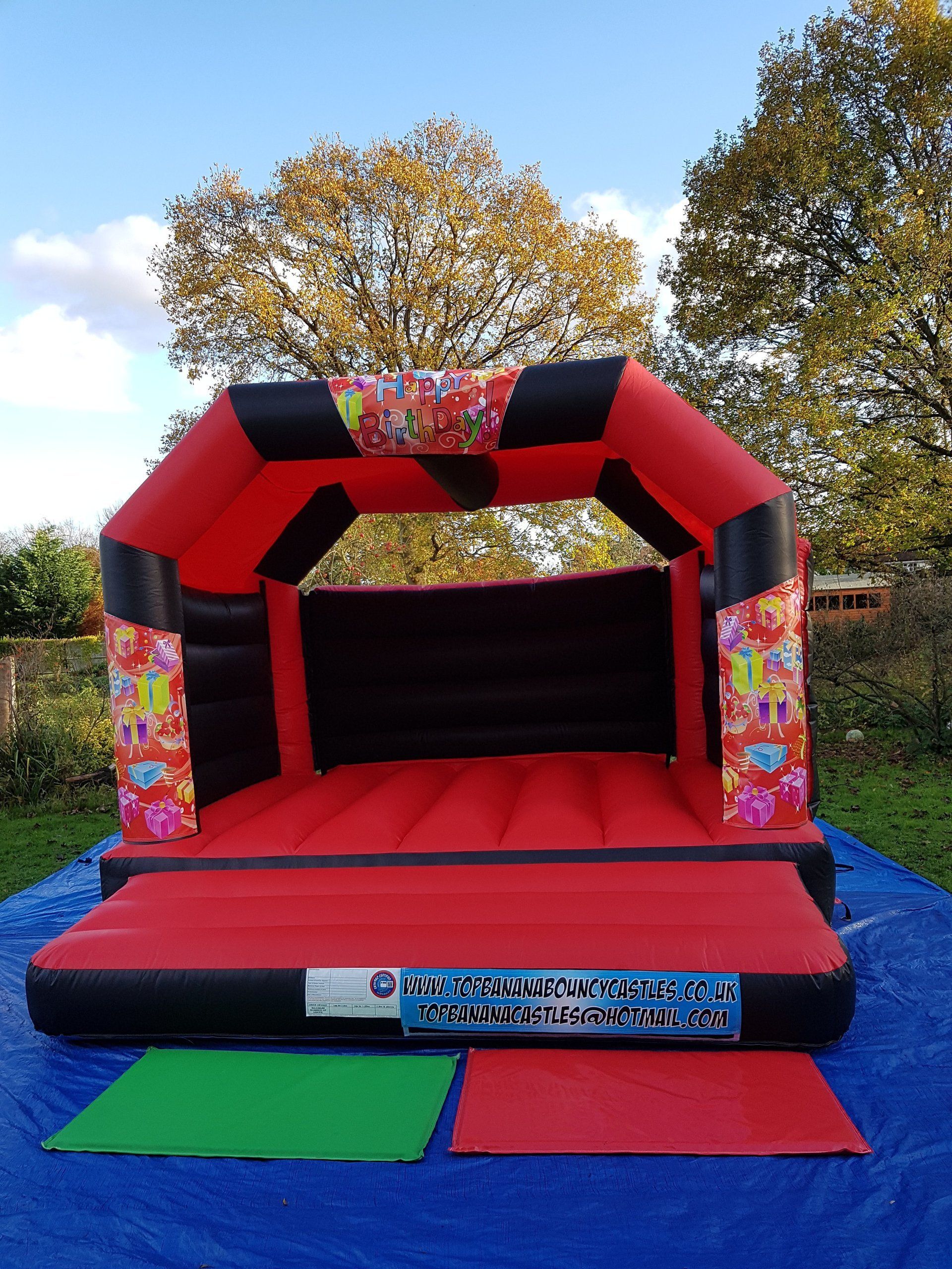red and black adult bouncy castle