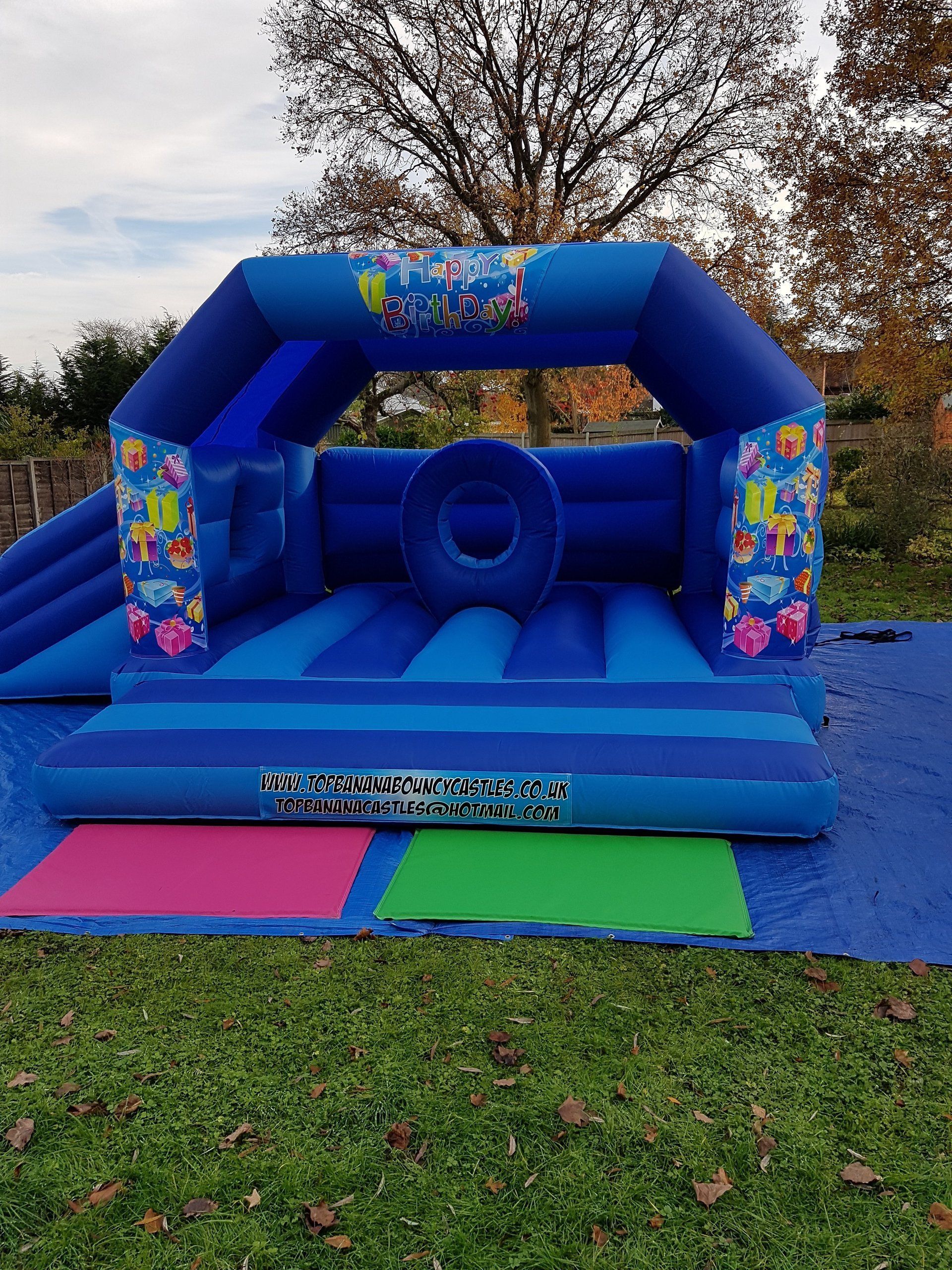 large bouncy castle with birthday artwork