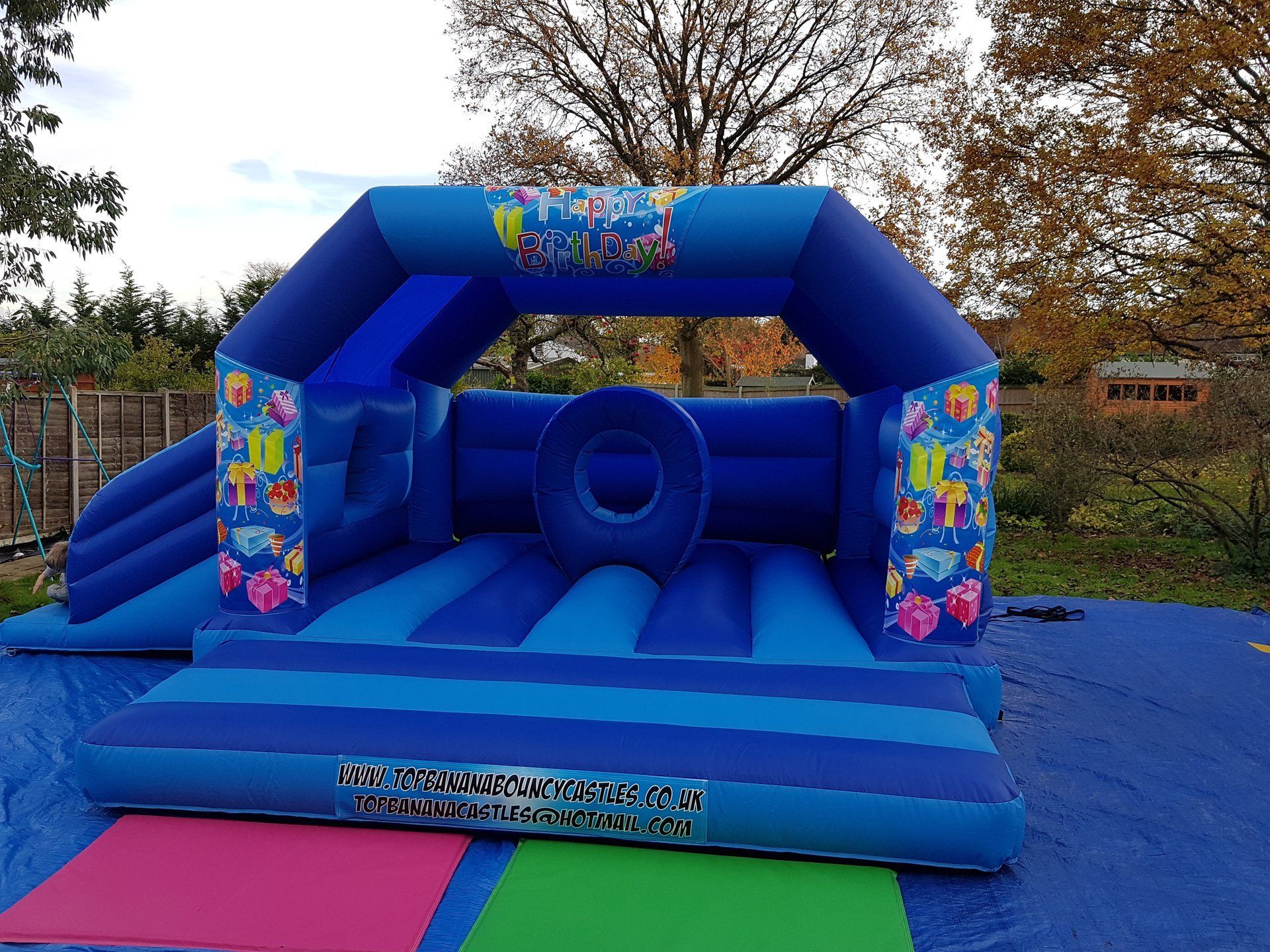 large bouncy castle with birthday artwork
