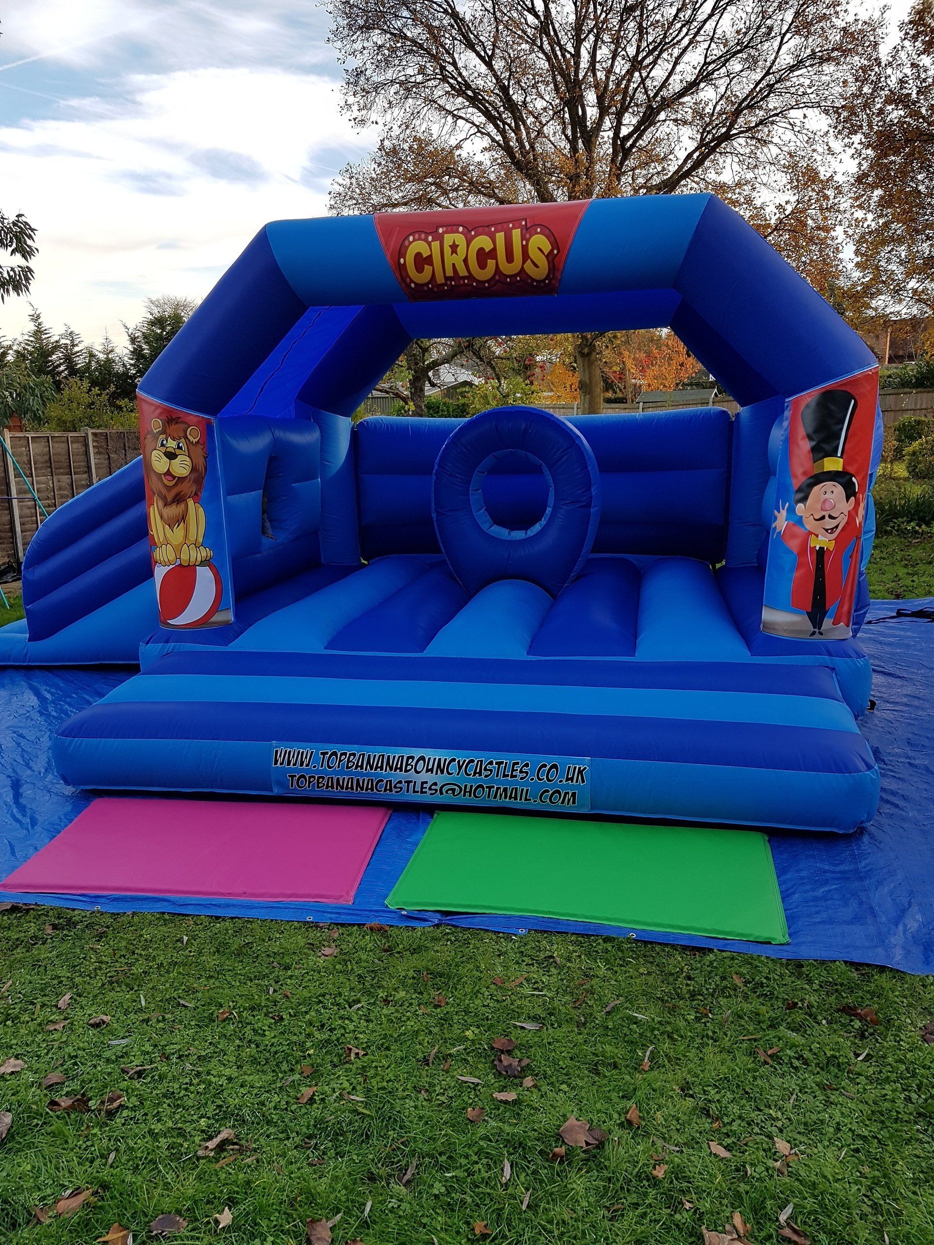 large bouncy castle with circus artwork