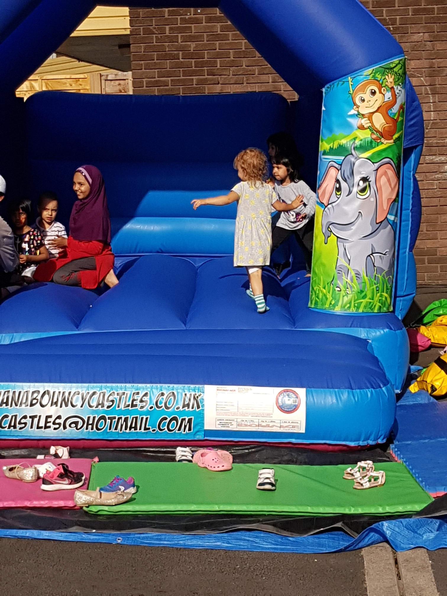 children enjoying a jungle themed slide combo bouncy castle