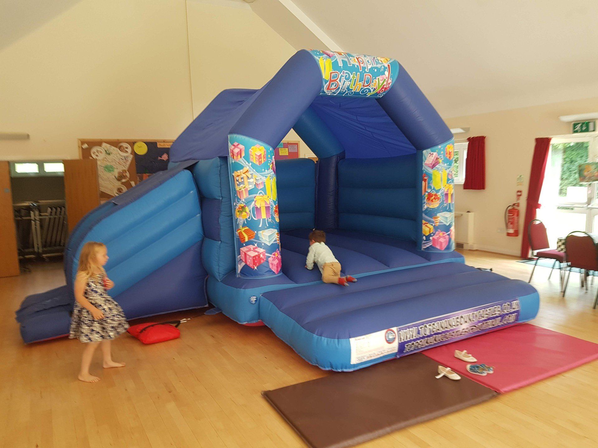 birthday theme slide combo bouncy castle in a hall