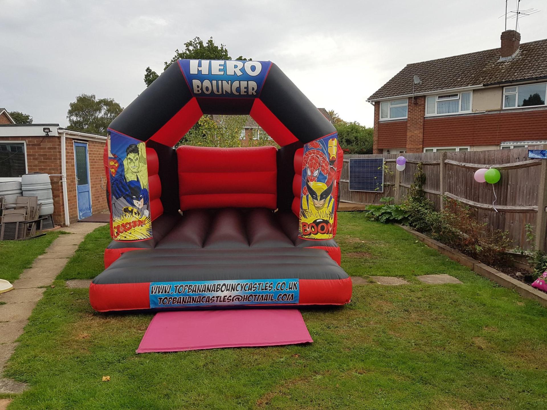 red and black super hero small bouncy castle