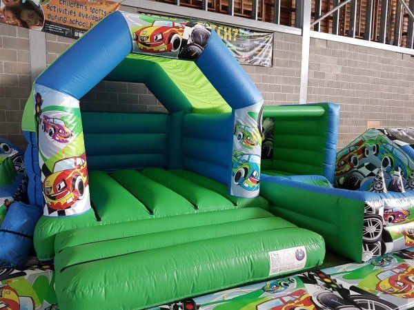 green and blue race car small bouncy castle