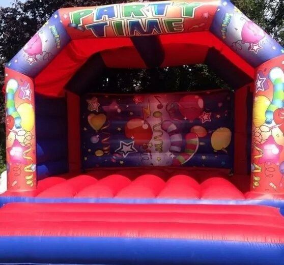 adult red and black bouncy castle with birthday theme