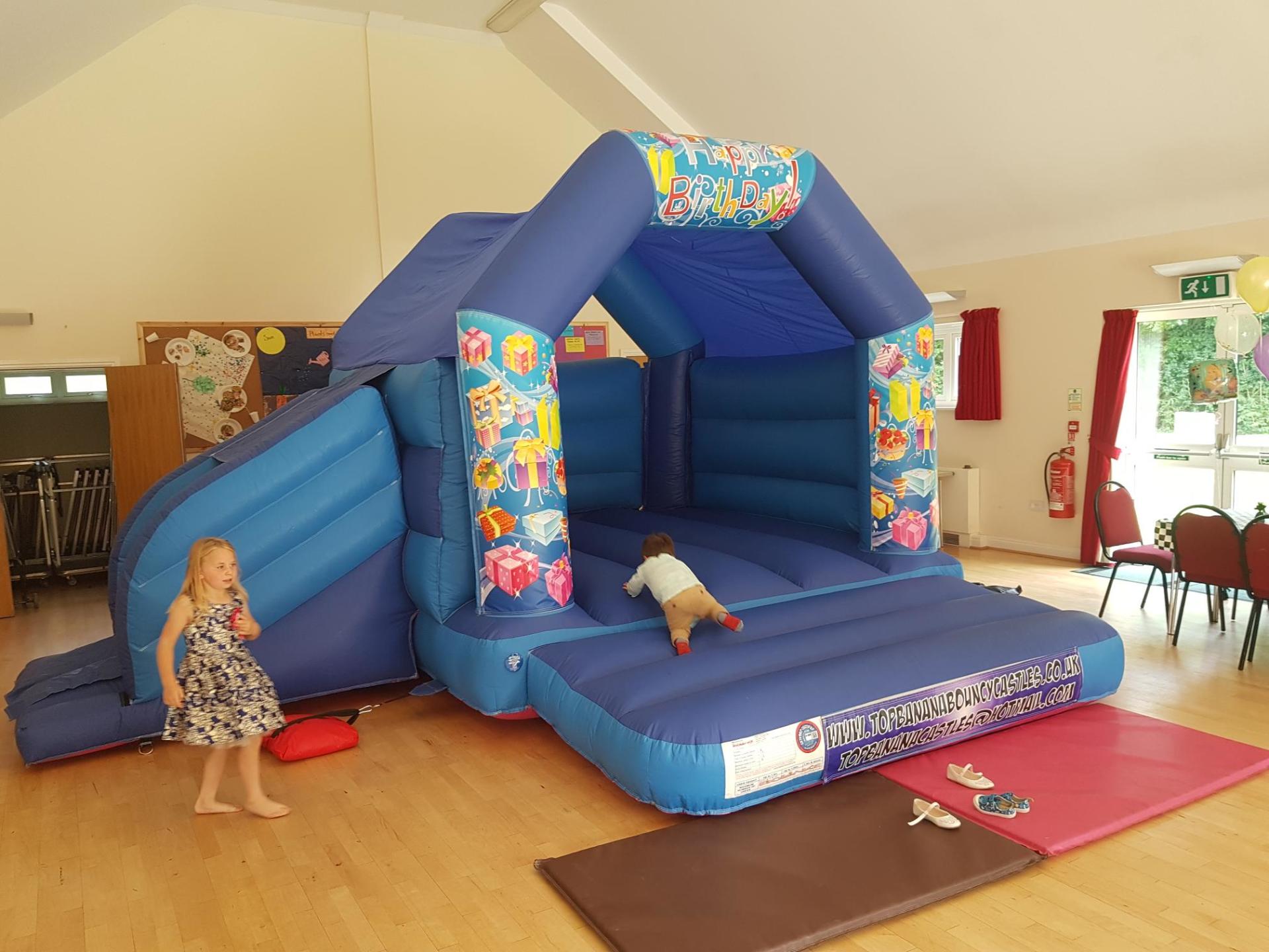 birthday theme slide combo bouncy castle in a hall