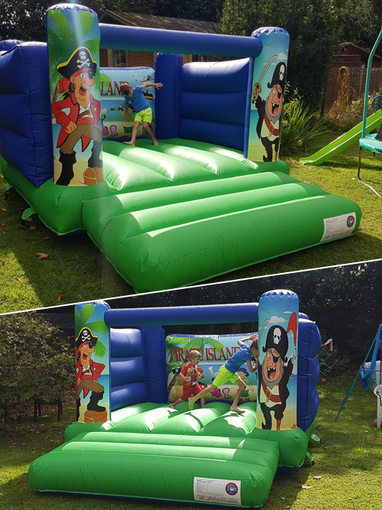 green and blue pirate themed bouncy castle