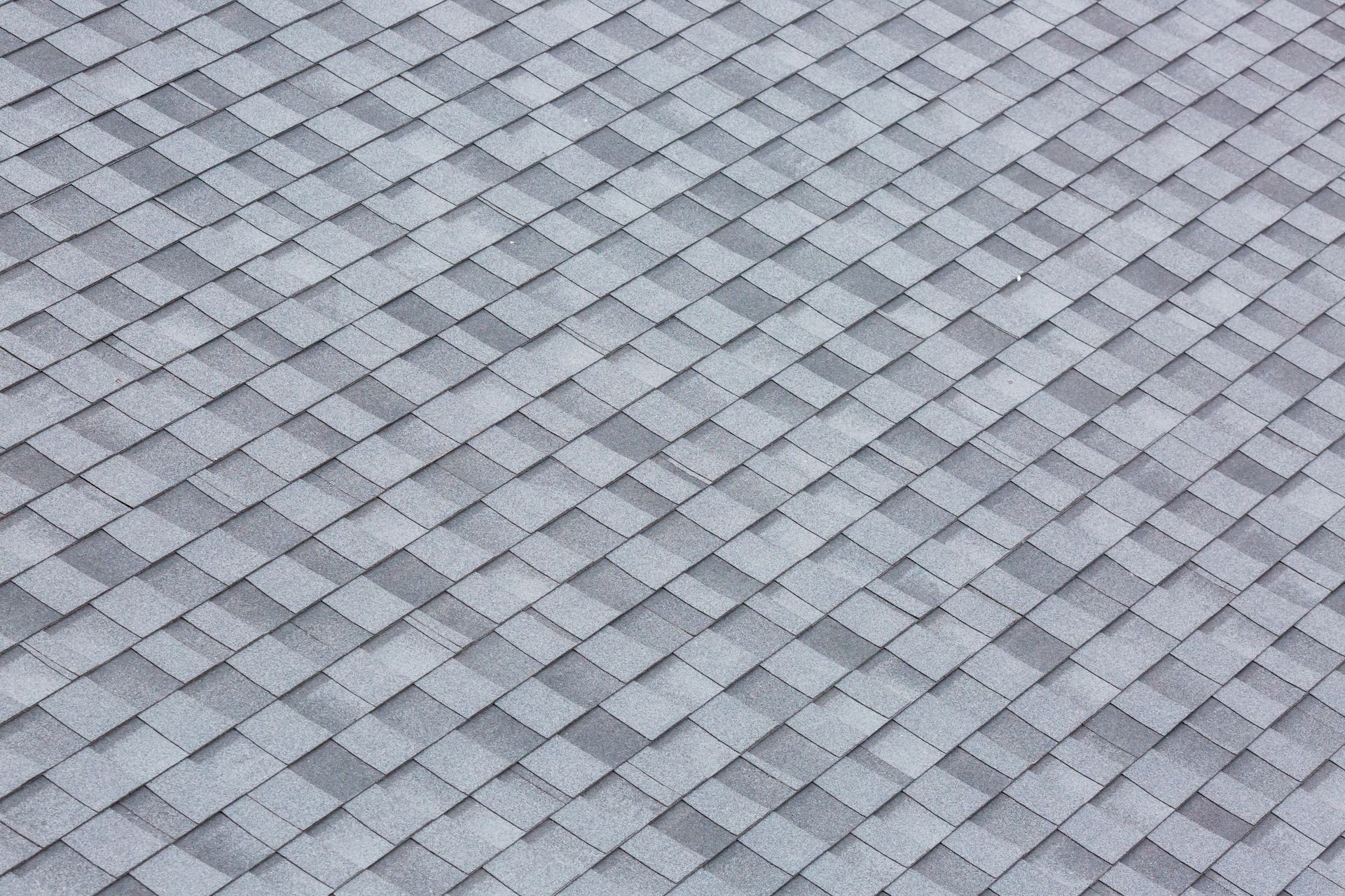 Red clay roof tiles, arranged in a pattern to show overlapping.