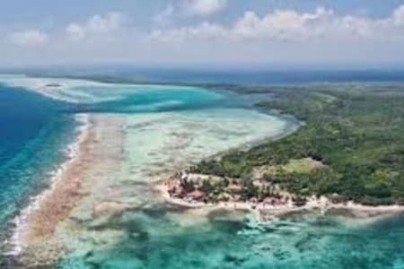 An aerial view of a small island in the middle of the ocean.