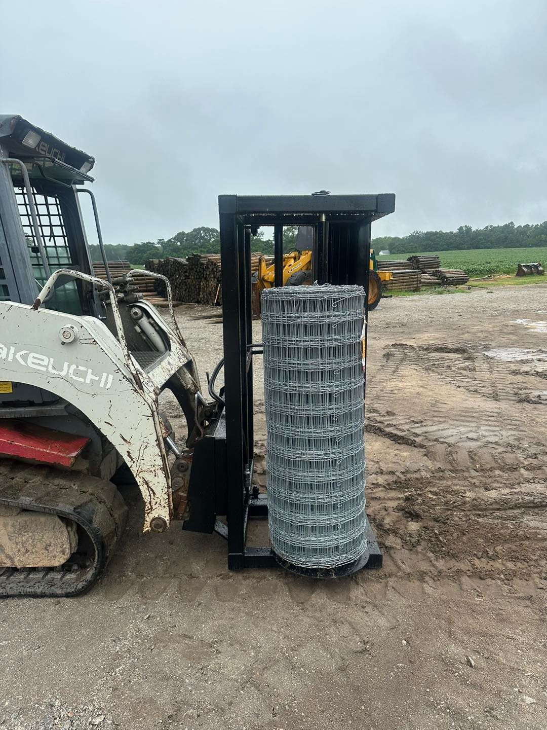 A Bulldozer Is Carrying A Roll Of Wire Fence | Monetta, SC | Monetta Farm Supply