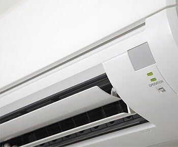 Air Conditioner On A White Wall — San Bernardino, CA — Mac's Aire Service