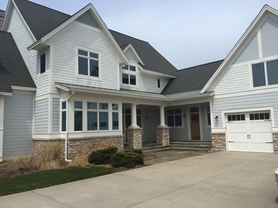 A large white house with a gray roof