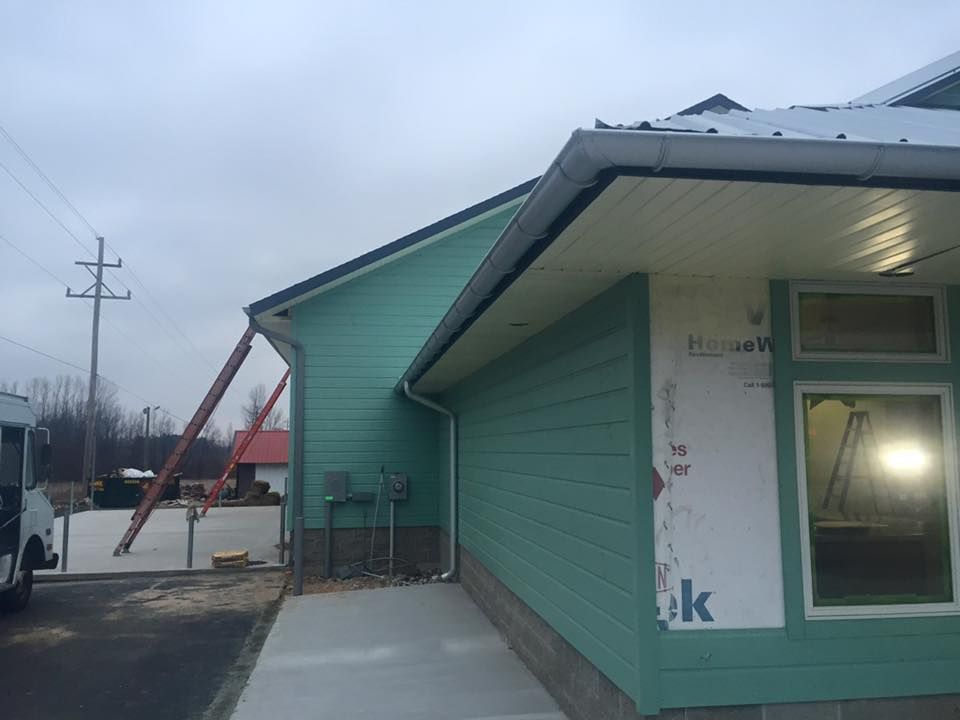 A green building with the word ok on the side