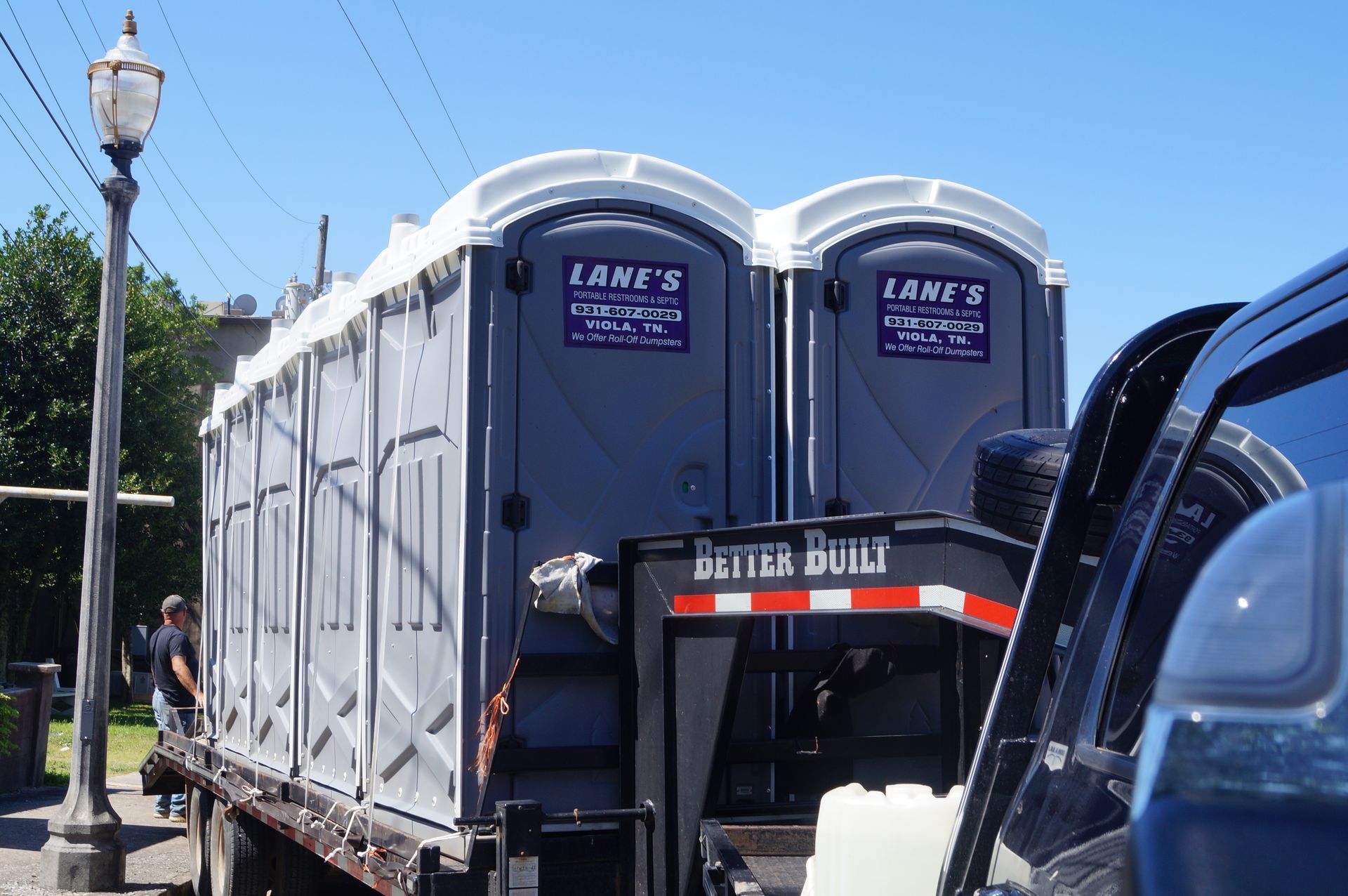 two lane 's portable toilets are on a trailer