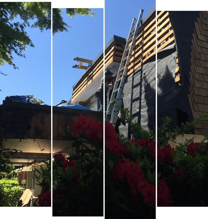 A man is kneeling on top of a tiled roof