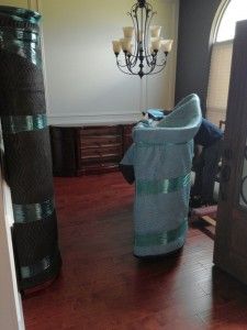 A living room filled with furniture and a chandelier.