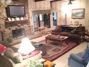 A living room filled with furniture and a television