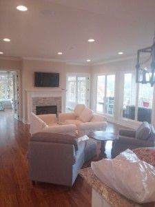 A living room filled with furniture and a fireplace.
