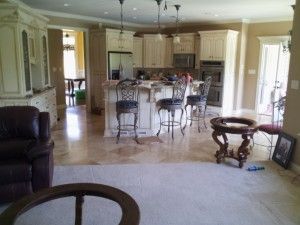 A living room filled with furniture and a kitchen.