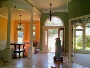 An empty room with green walls and a table