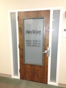 A door with a sign on it that says arkansas surgical center