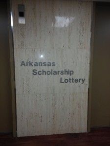 There is a sign on the wall that says arkansas scholarship lottery.